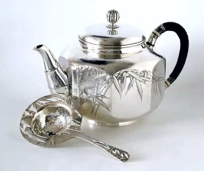 Aesthetic Movement silver teapot with bamboo motif and hammered finish