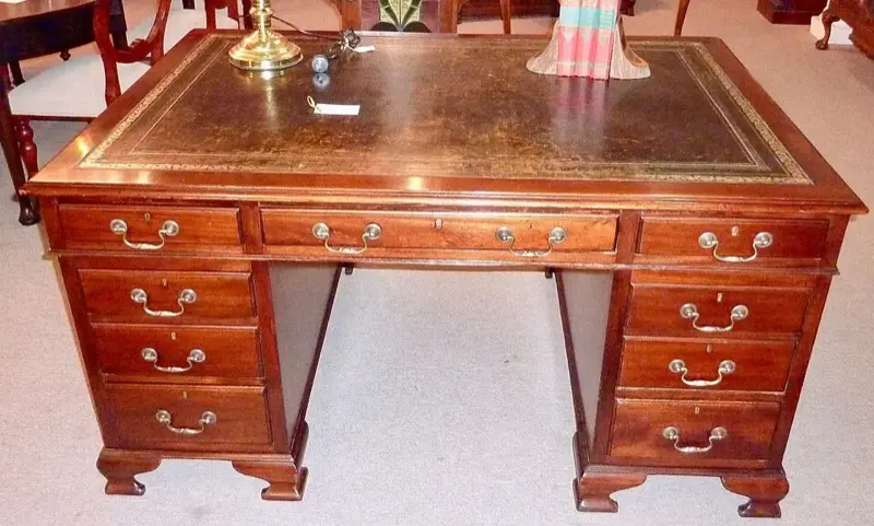 Victorian partners desk in mahogany with green leather top and brass handles
